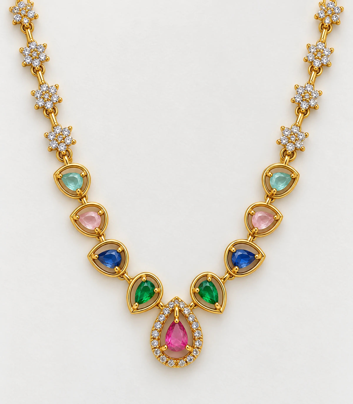 Closeup of multicolour teardrop settings, clear floral links and the pink centre pendant