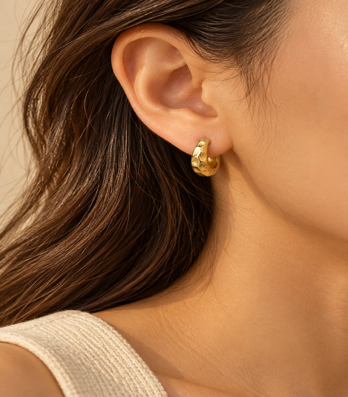 JIMIKI Gold Organic Hammered Huggie Earrings — editorial worn styling #color_gold-tone