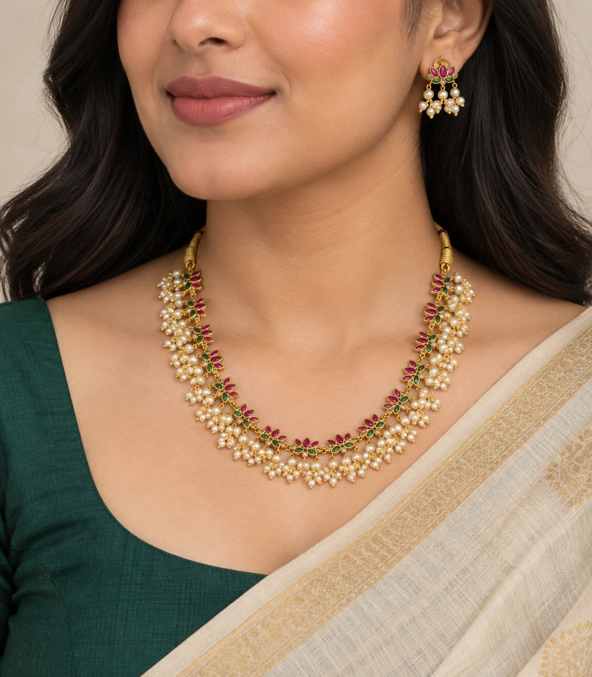 Gold Pearl Fringe Floral Necklace Set worn with a green blouse and cream saree