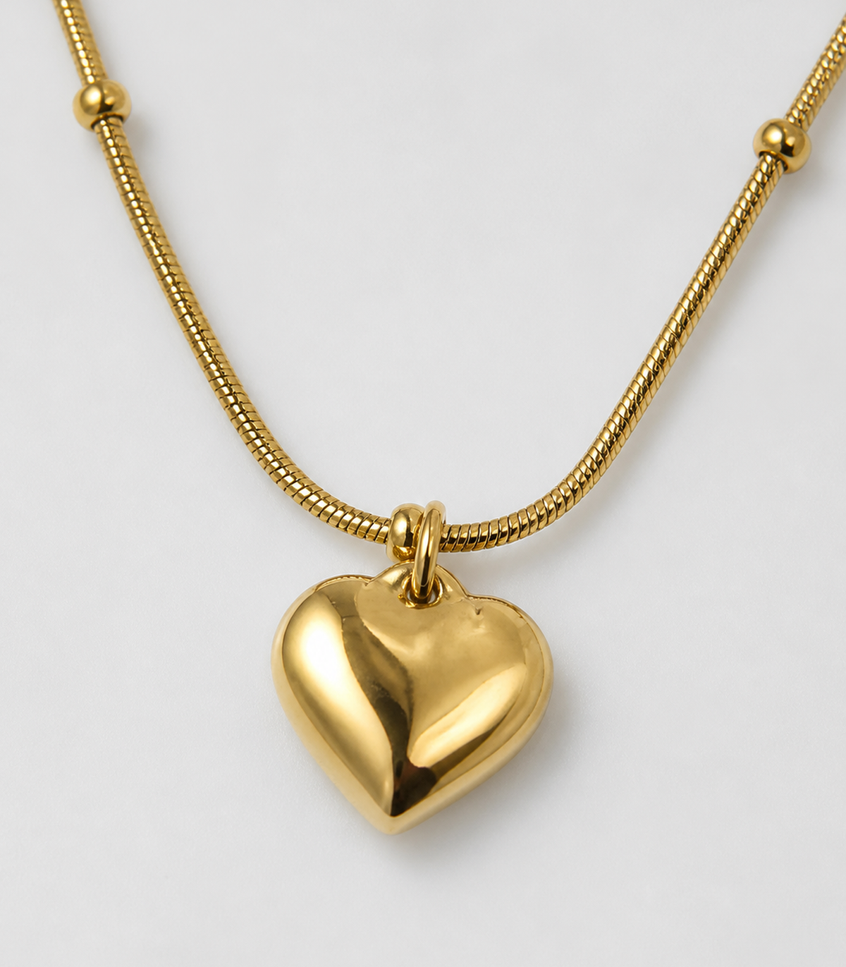 Close-up of Gold Puffed Heart Bead Necklace