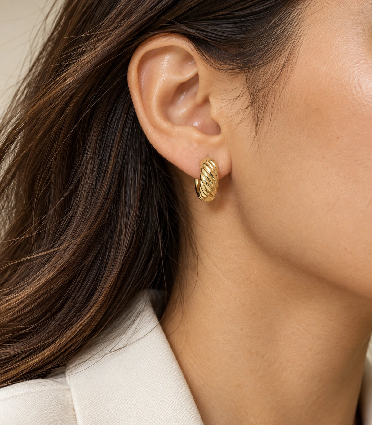 JIMIKI Twisted Rope Huggie Earrings in Gold Tone — editorial worn styling #color_gold-tone