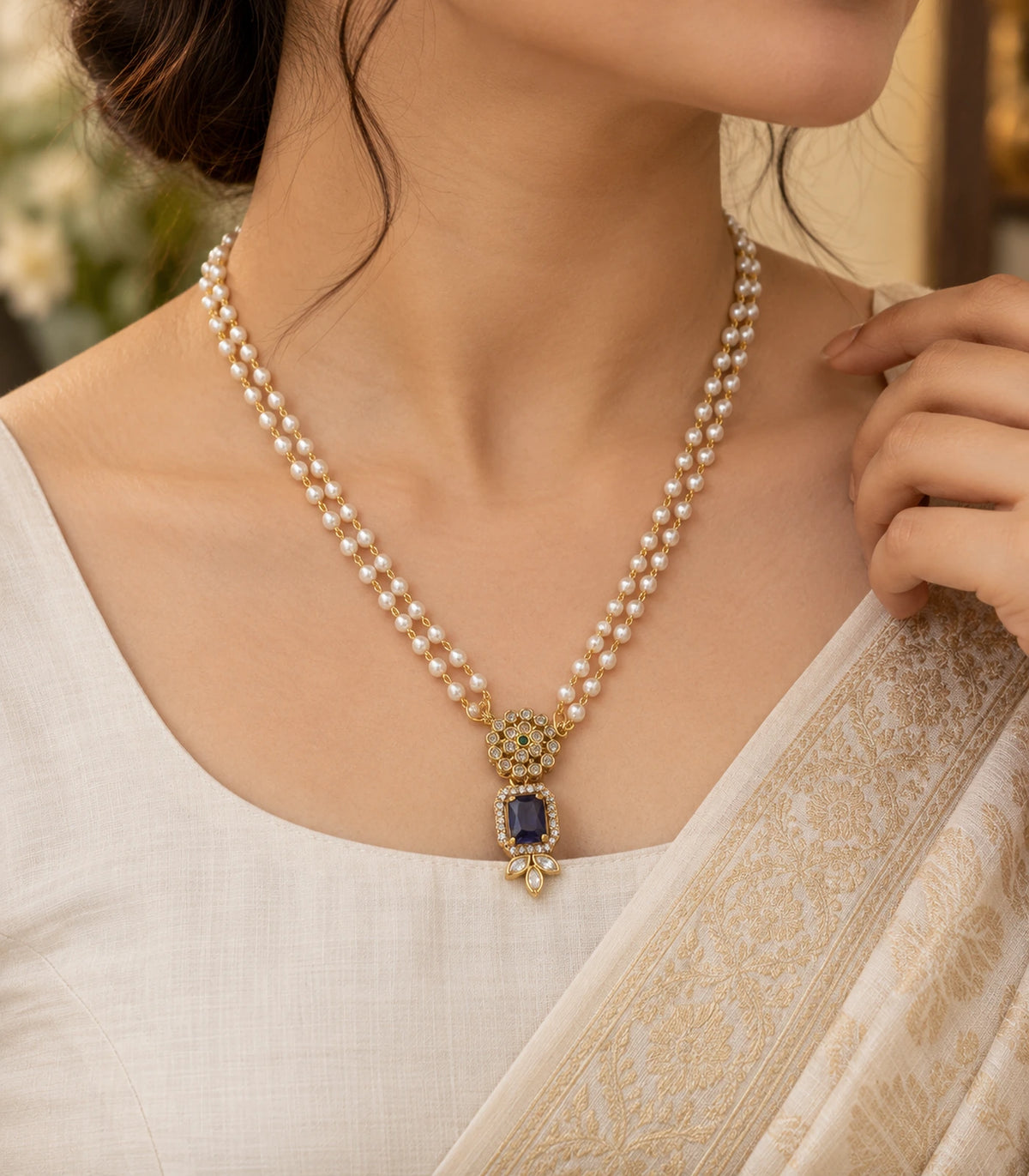 Gold Sapphire Kundan Double Pearl Necklace worn in a turned pose with ivory styling