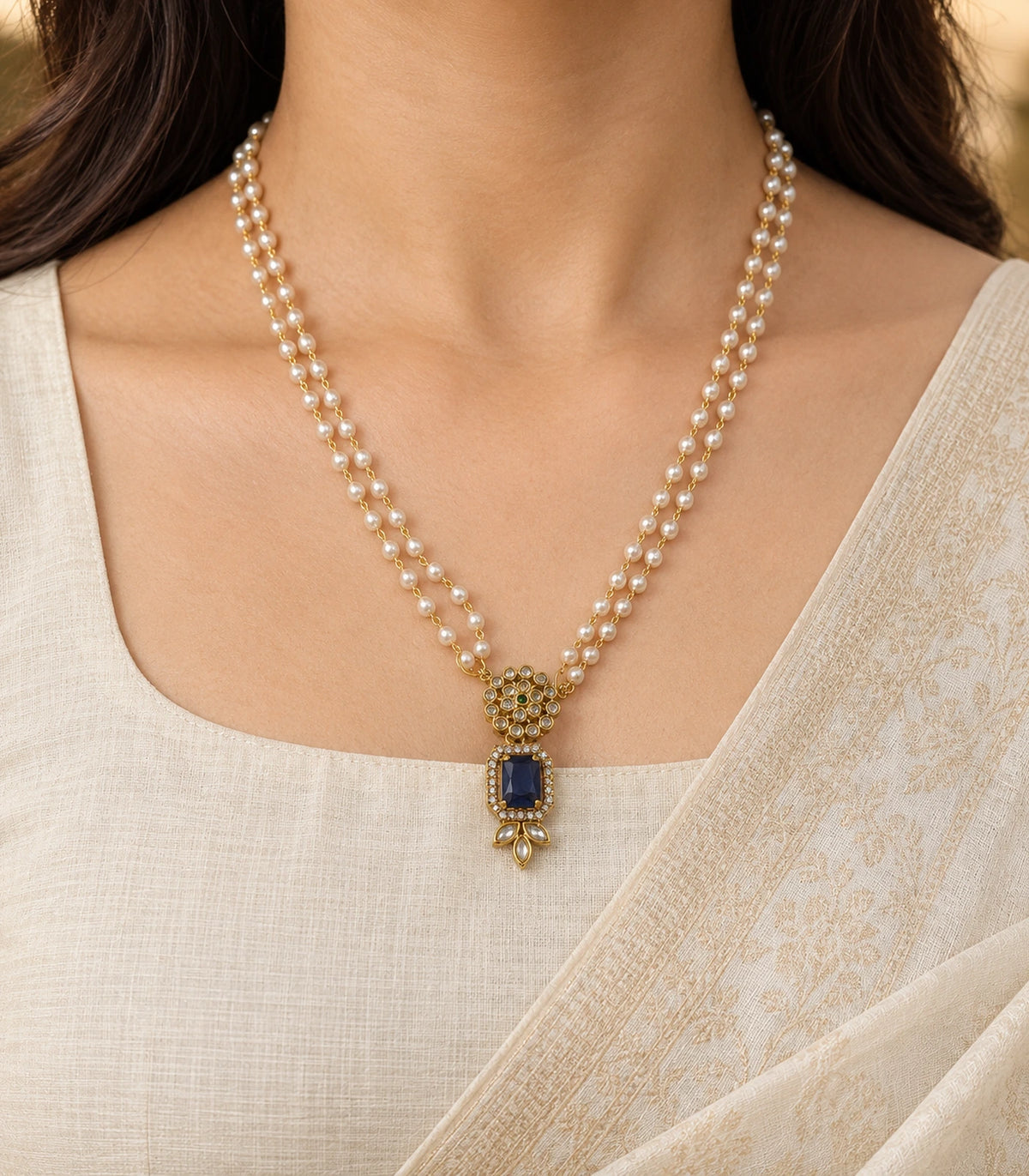Gold Sapphire Kundan Double Pearl Necklace worn with an ivory outfit