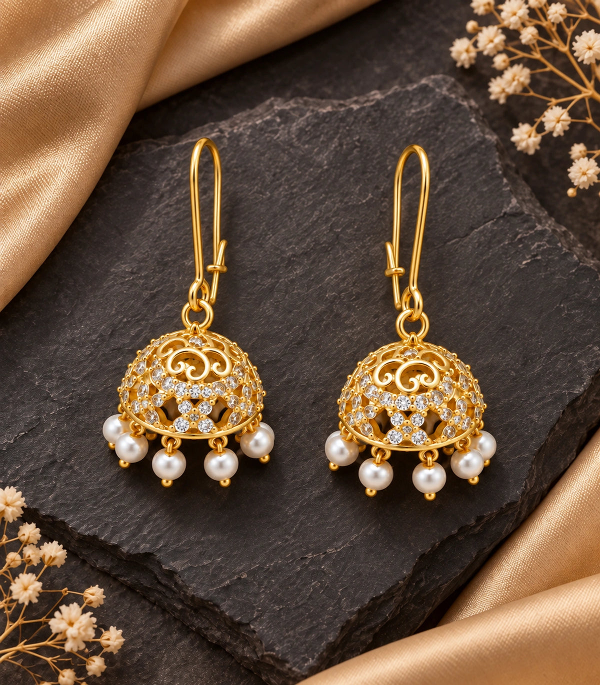 Gold Scrollwork Crystal Jhumka Earrings in Gold — pair with long wire fastenings on dark stone and gold fabric #color_gold