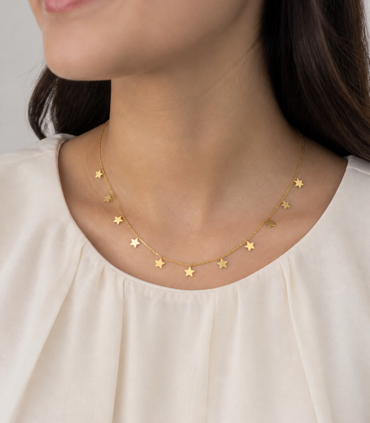 Gold Star Charm Necklace styled on a model