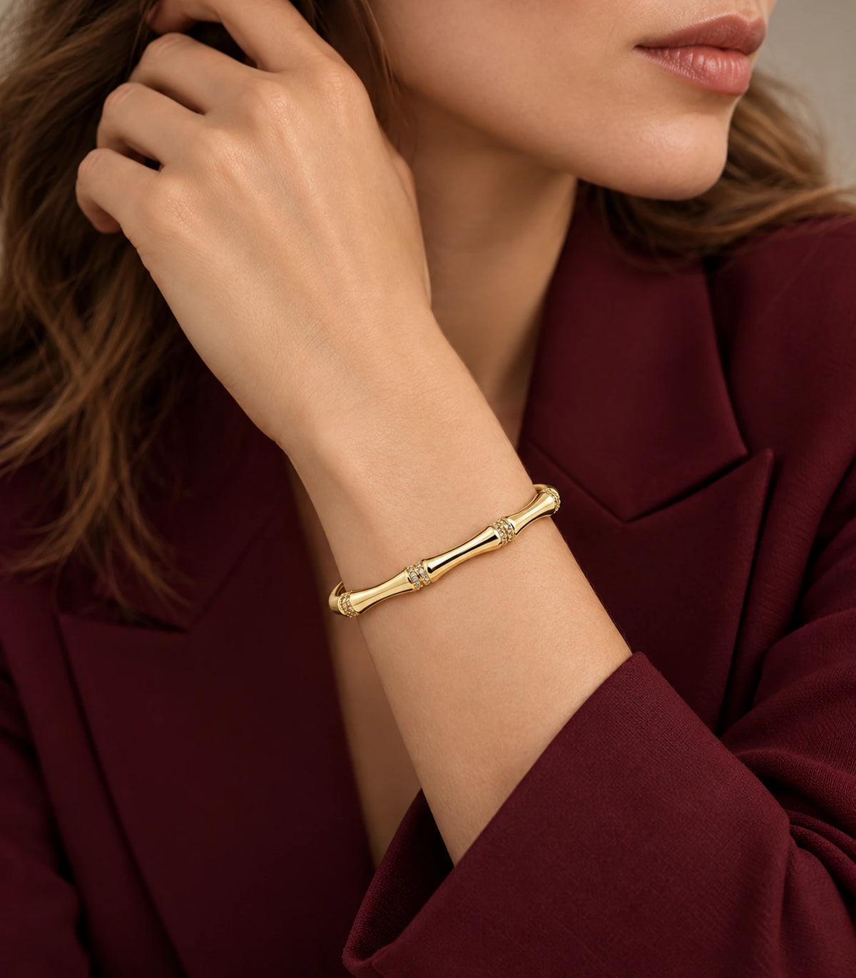 JIMIKI Gold-Tone Bamboo Crystal Collar Bangle — bangle styled with an outfit #color_gold-tone / clear