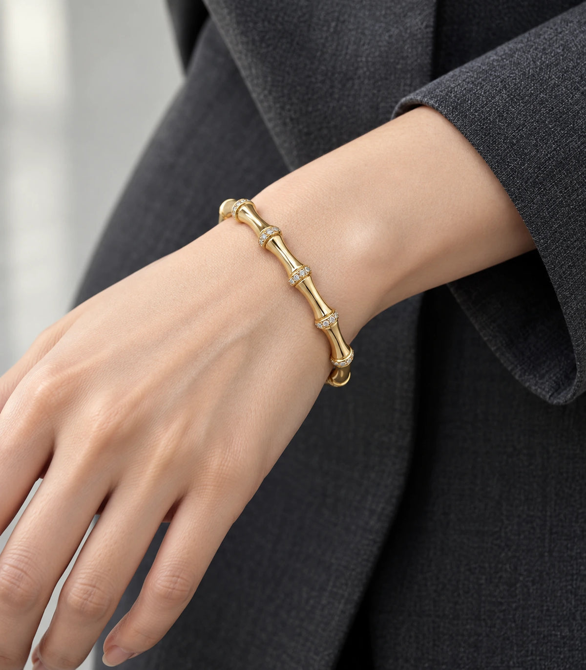 JIMIKI Gold-Tone Bamboo Pavé Collar Bangle — bangle styled with an outfit #color_gold-tone / clear