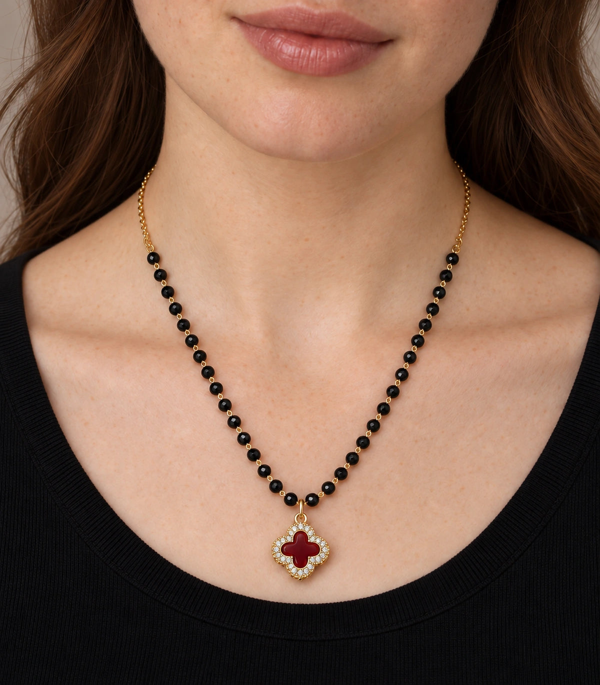 JIMIKI Gold-Tone Black-Bead Red-Quatrefoil Pendant Necklace in Gold Tone / Black / Red - close-up details #color_gold-tone-black-red