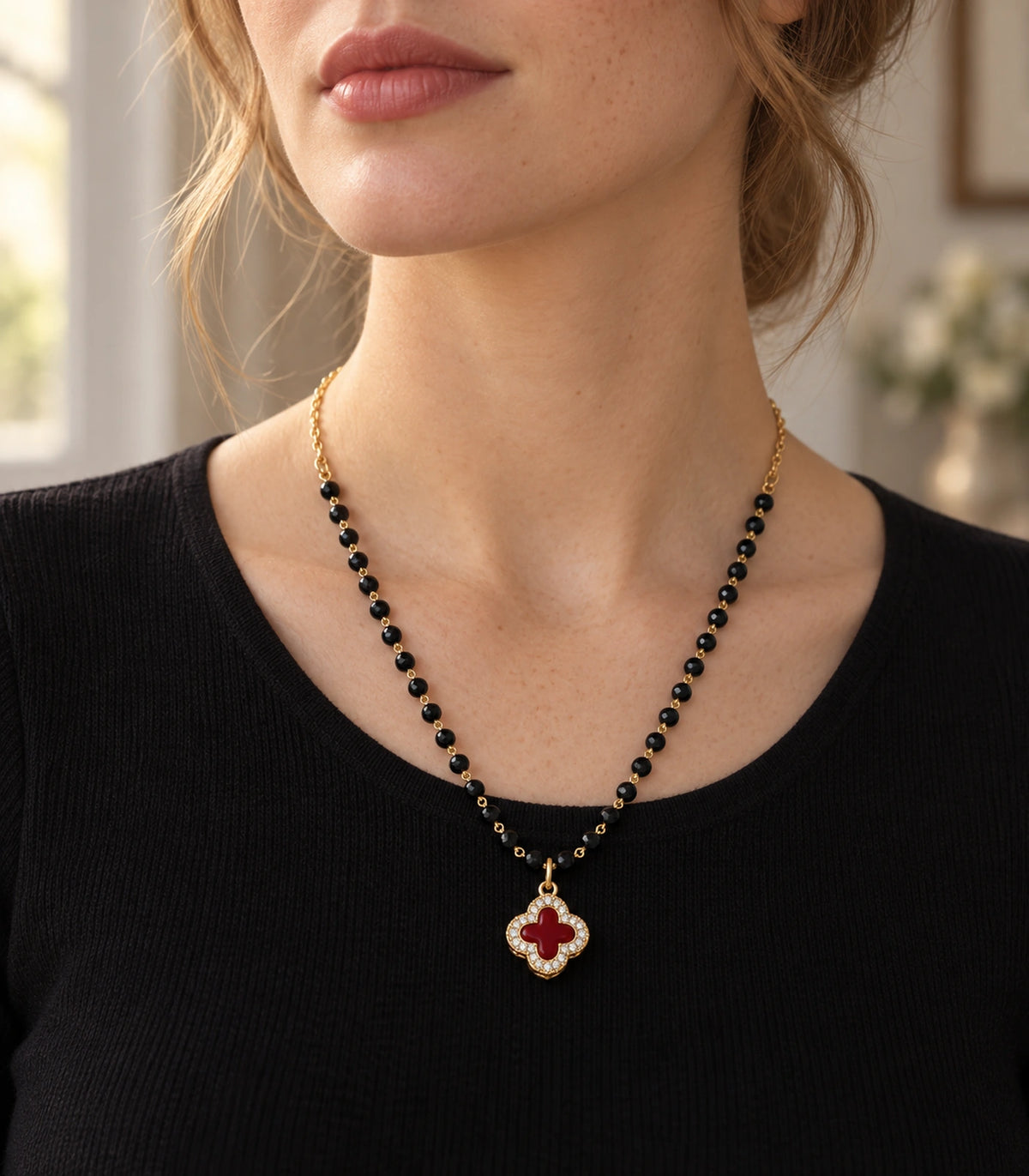 JIMIKI Gold-Tone Black-Bead Red-Quatrefoil Pendant Necklace in Gold Tone / Black / Red - editorial worn view #color_gold-tone-black-red
