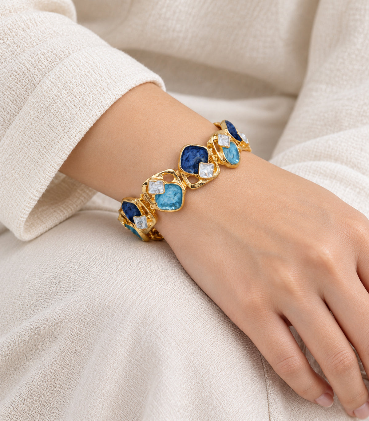 Gold-tone blue geometric openwork bracelet — model view