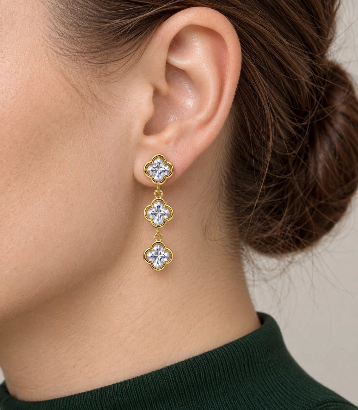 JIMIKI Triple Quatrefoil Crystal Drop Earring Pair in Gold tone / clear, close-up detail #color_gold tone / clear