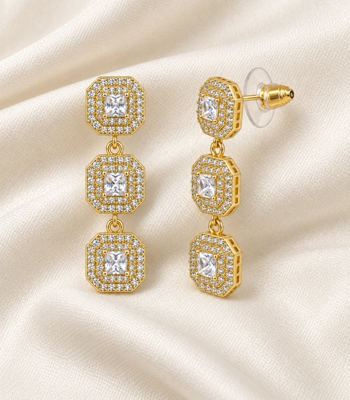 JIMIKI Triple Square Halo Drop Earring Pair in Gold tone / clear, editorial flat lay #color_gold tone / clear