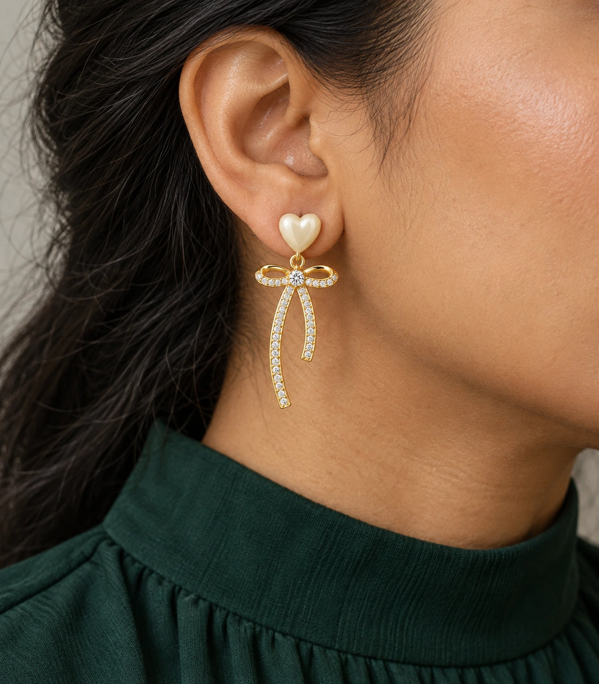 JIMIKI Heart Crystal Ribbon Bow Drop Earring Pair in Gold-tone / Cream, close-up detail #color_gold-tone / cream