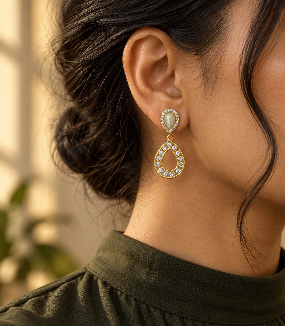JIMIKI Gold Tone Cream Teardrop Crystal Halo Drop Earring Pair in Gold tone / Cream, editorial model view