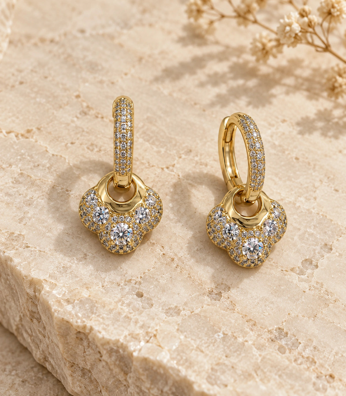 JIMIKI Crystal Clover Charm Hoop Earring Pair in Gold Tone, editorial flat lay #color_gold tone