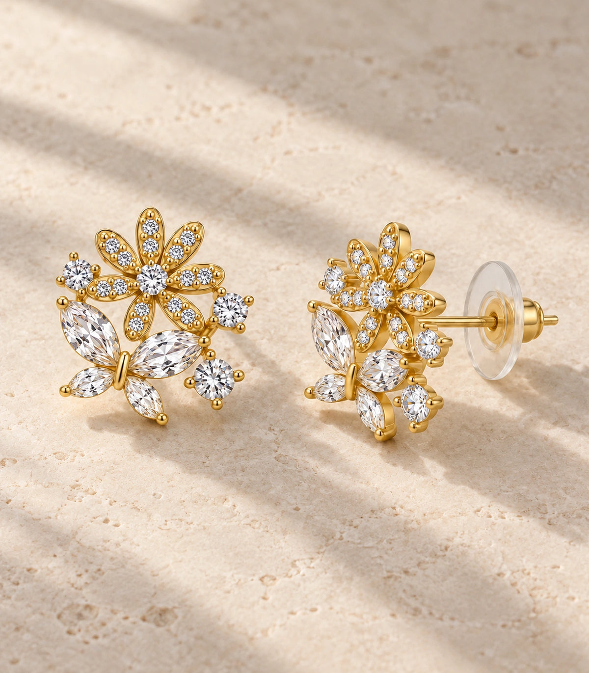 JIMIKI Gold Tone Crystal Flower Butterfly Cluster Stud Earring Pair in Gold-tone, editorial flat lay