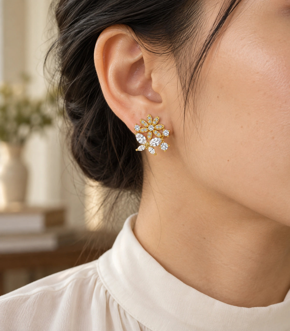 JIMIKI Gold Tone Crystal Flower Butterfly Cluster Stud Earring Pair in Gold-tone, editorial model view