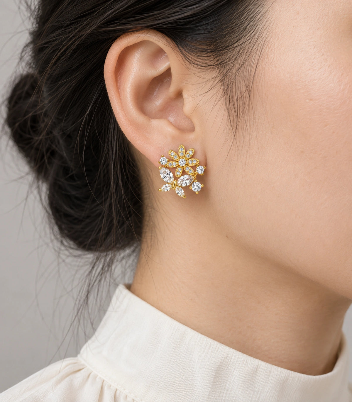 JIMIKI Gold Tone Crystal Flower Butterfly Cluster Stud Earring Pair in Gold-tone, model wearing view