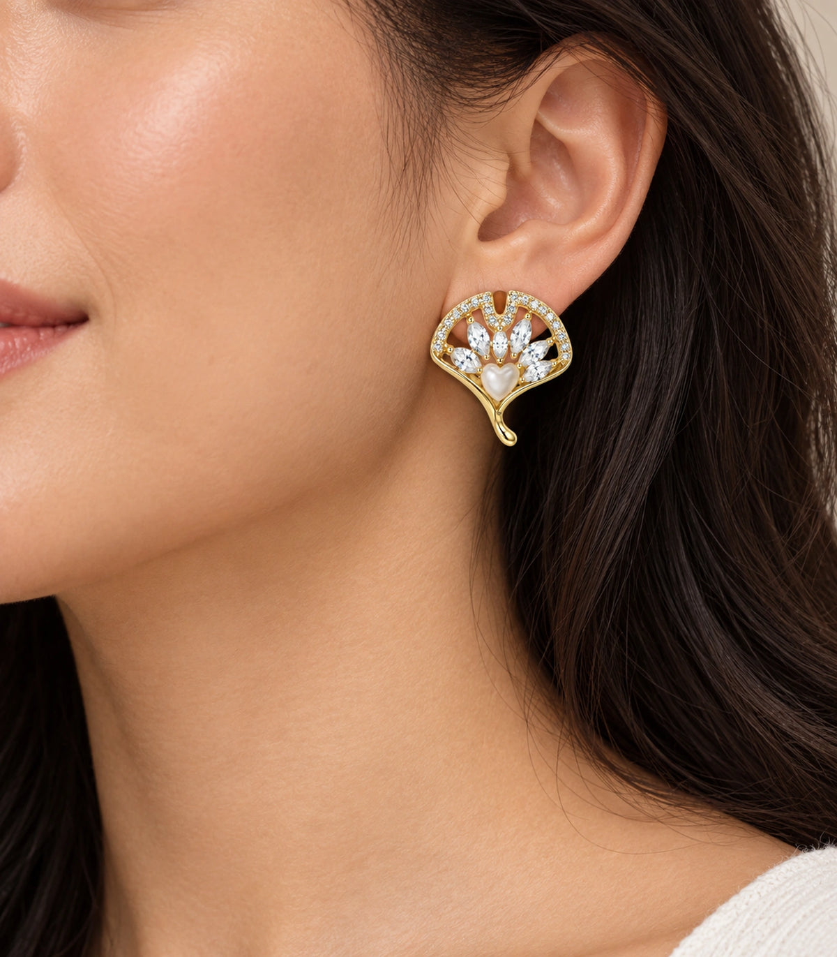 JIMIKI Gold-Tone Crystal Ginkgo Leaf Heart-Accent Stud Earrings in Gold / Clear / Milky White, model wearing view