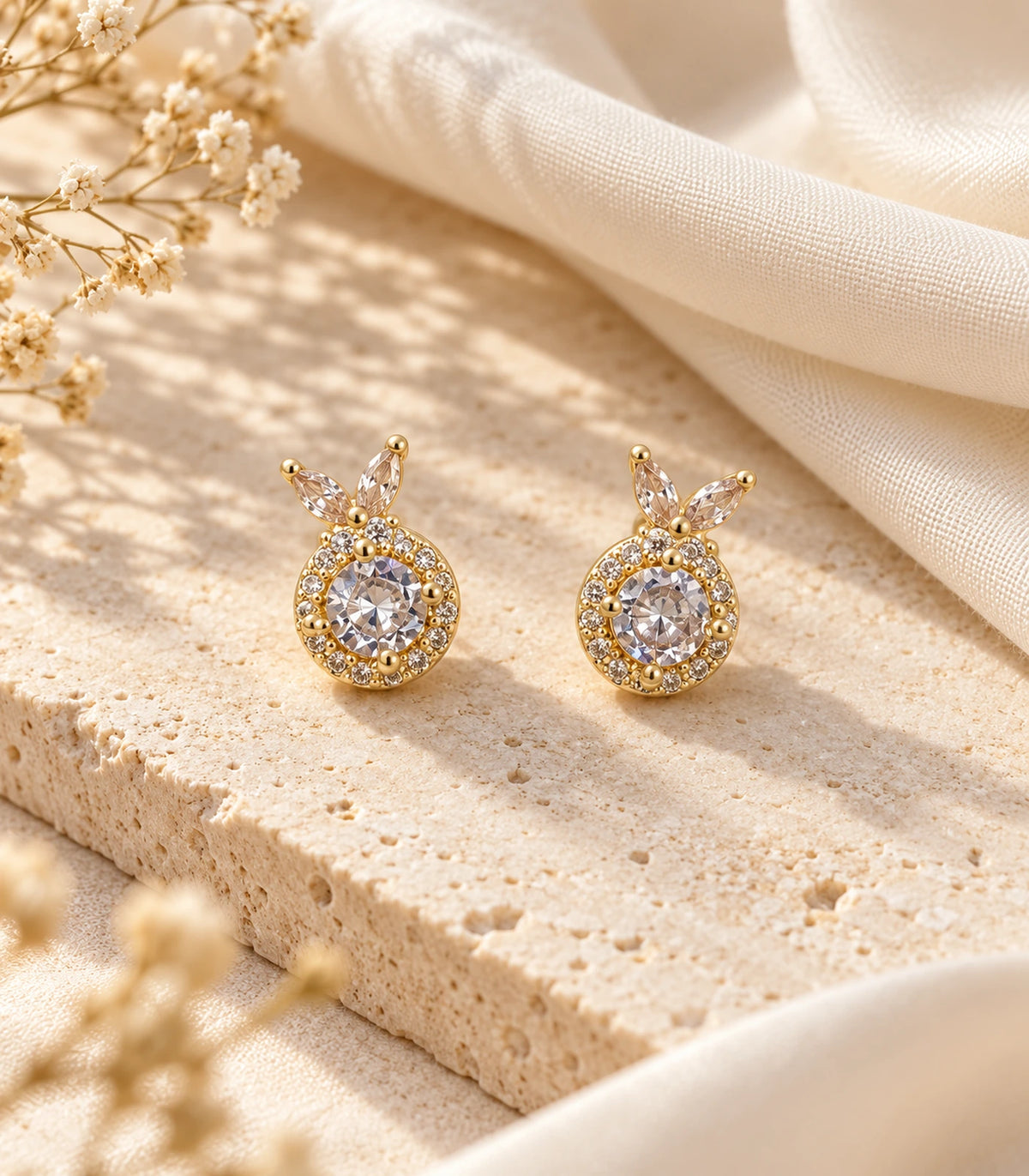 JIMIKI Crystal Halo Leaf Stud Earrings in Gold Tone - editorial-flatlay #color_gold-tone