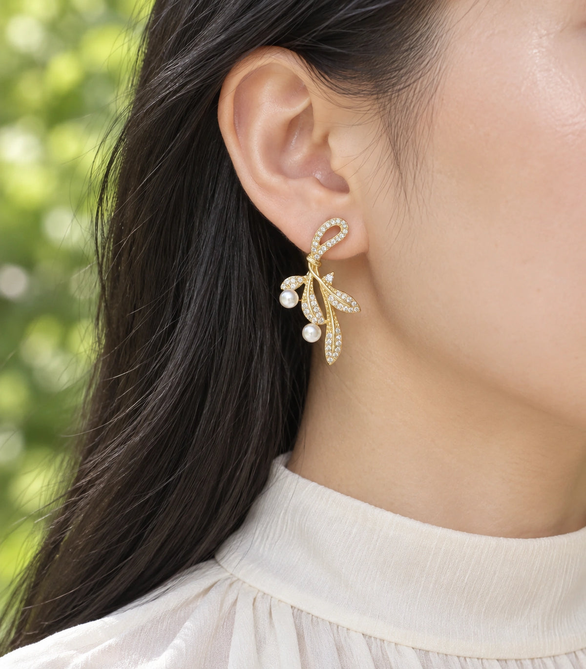 JIMIKI Crystal Leaf Two Pearl Drop Earring Pair in Gold-tone, editorial model view #color_gold-tone