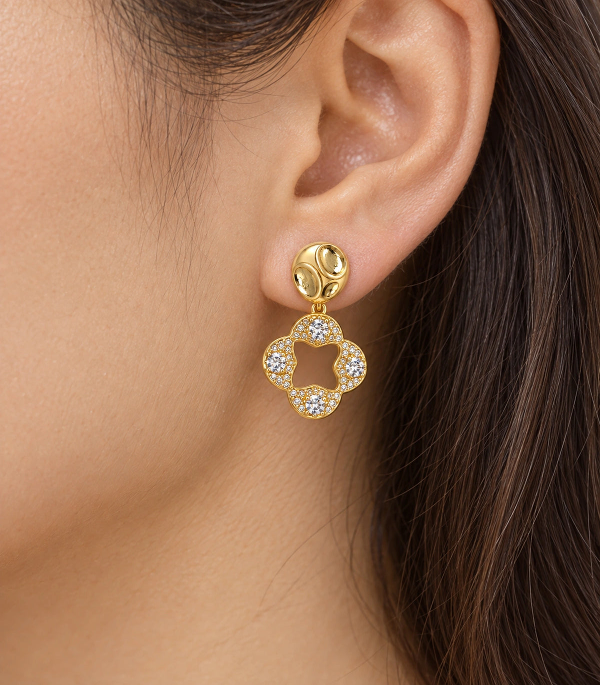 JIMIKI Gold-Tone Crystal Open Quatrefoil Organic Pebble Drop Earrings in Gold / Clear, close-up detail