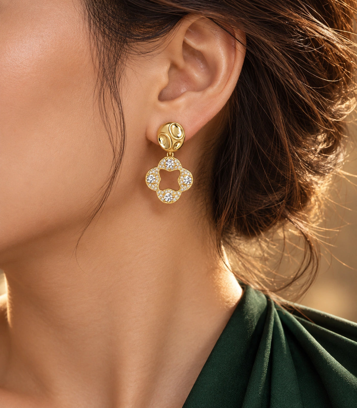JIMIKI Gold-Tone Crystal Open Quatrefoil Organic Pebble Drop Earrings in Gold / Clear, editorial model view