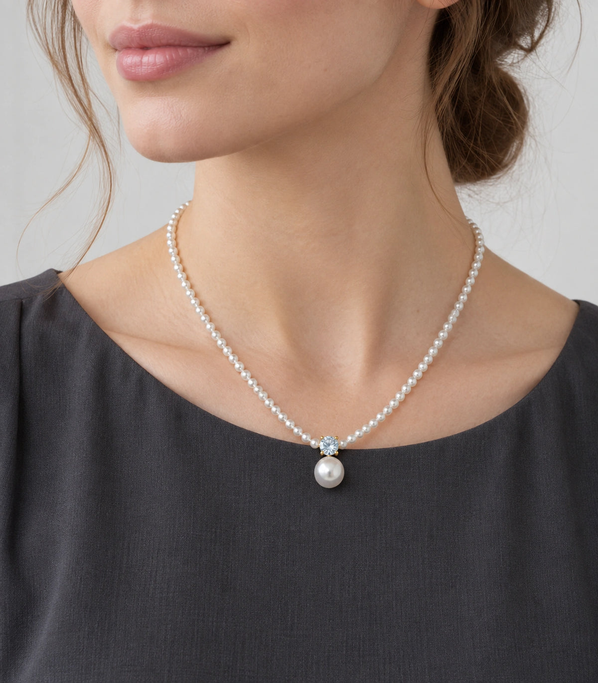 JIMIKI Gold Tone Crystal Pearl Drop Beaded Necklace in Gold tone / white, editorial model view