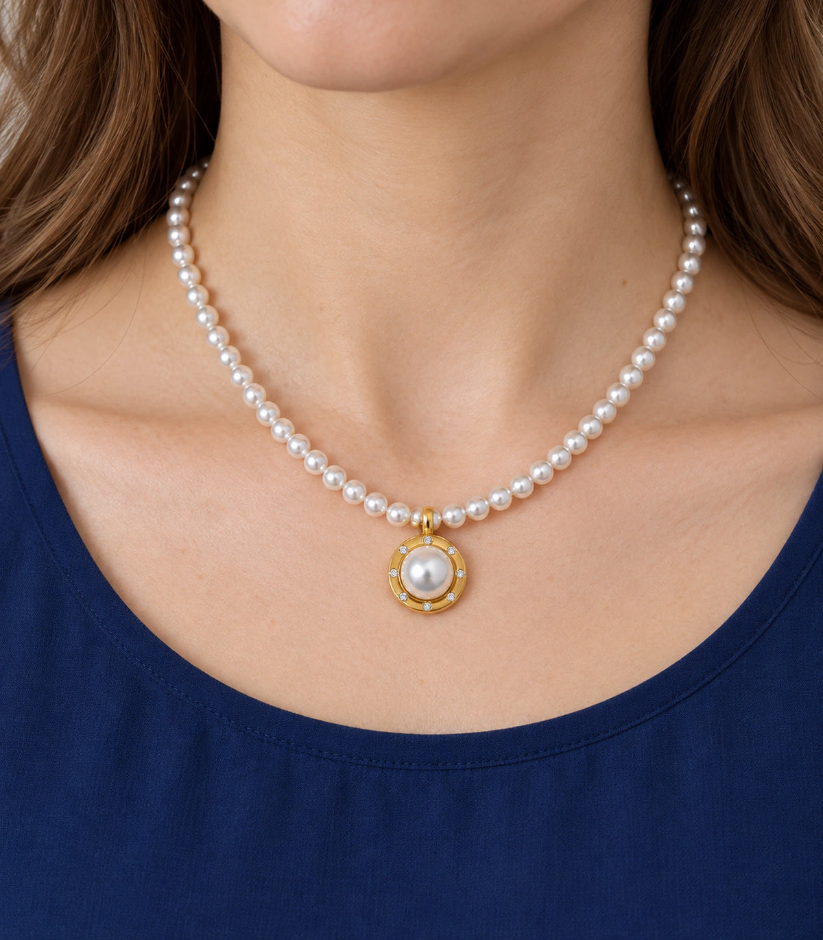 JIMIKI Gold Tone Crystal Rim Pearl Pendant Necklace in Gold / White, model wearing view