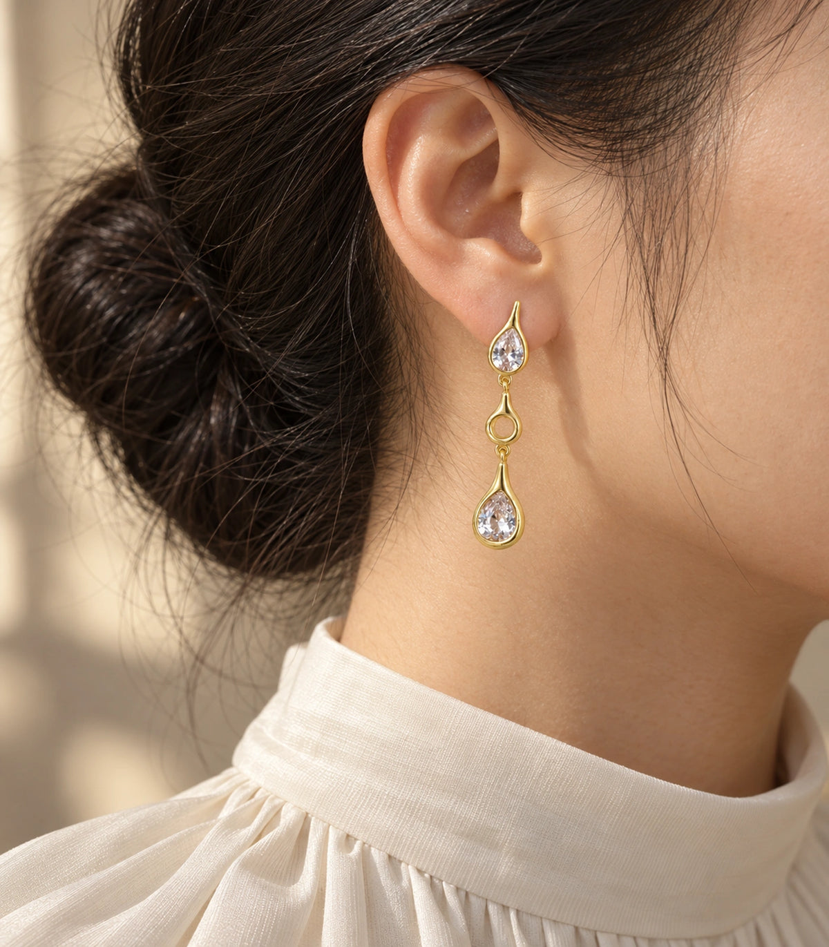 JIMIKI Crystal Teardrop Open Link Drop Earring Pair in Gold tone, editorial model view #color_gold tone