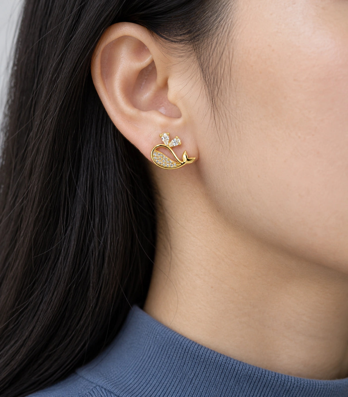 JIMIKI Crystal Whale Stud Earring Pair in Gold-tone, model wearing view #color_gold-tone