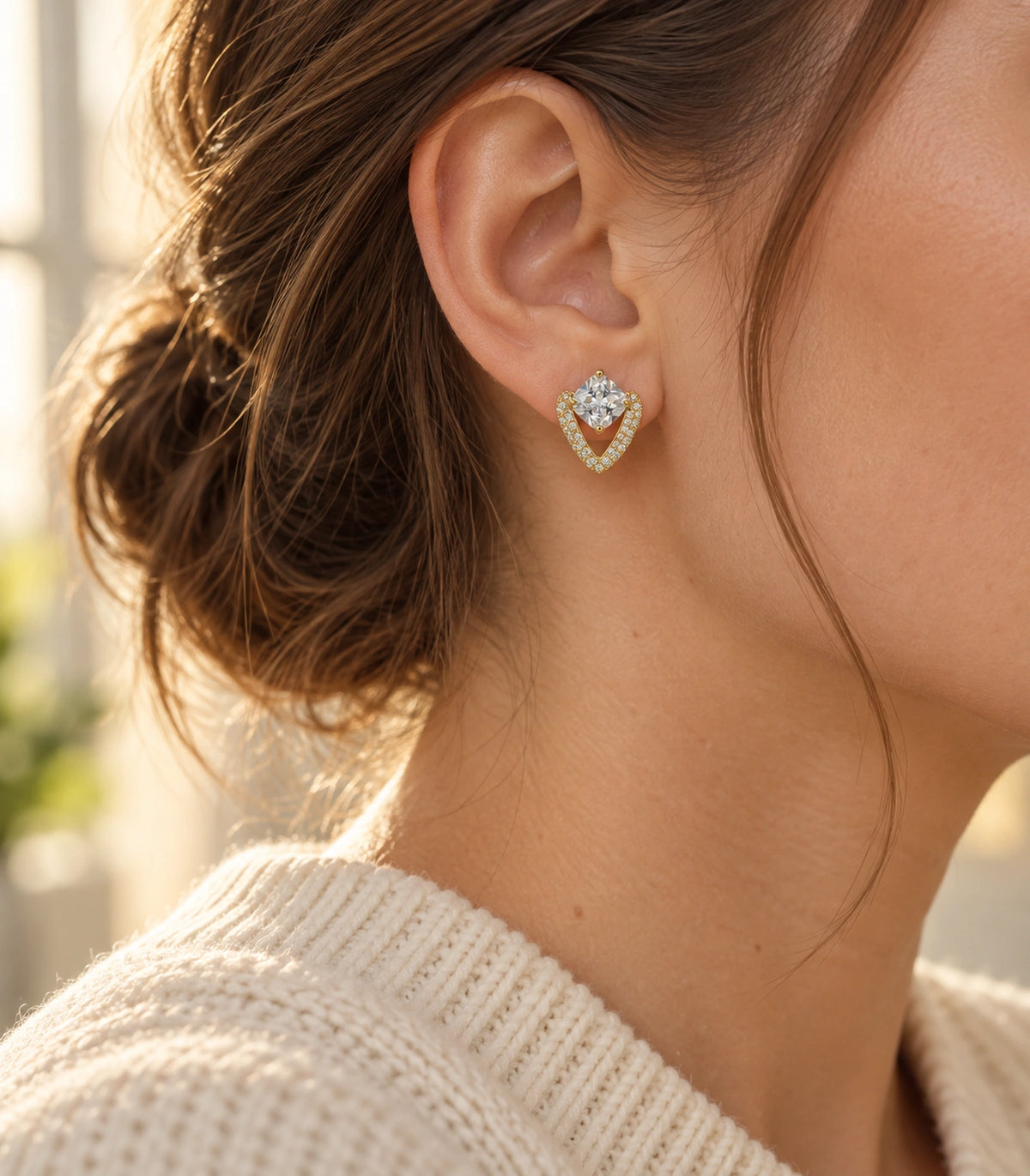 JIMIKI Gold Tone Cushion Crystal V Frame Stud Earring Pair in Gold-tone, editorial model view