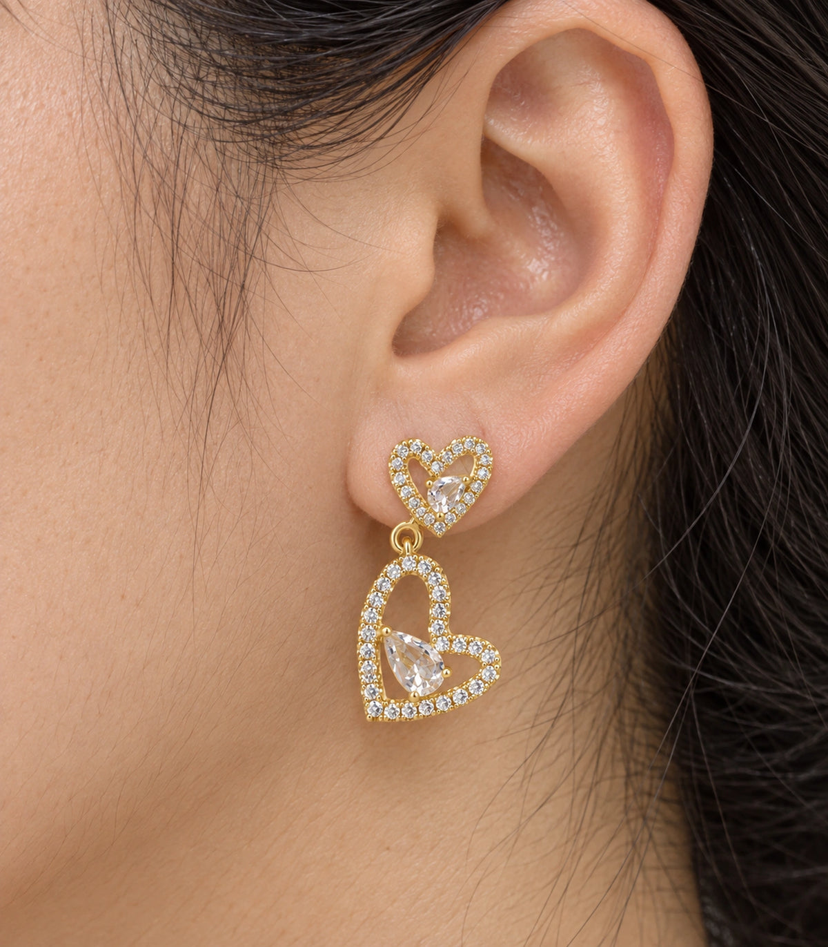JIMIKI Double Heart Pear Crystal Drop Earrings in Gold Tone, close-up detail #color_gold tone