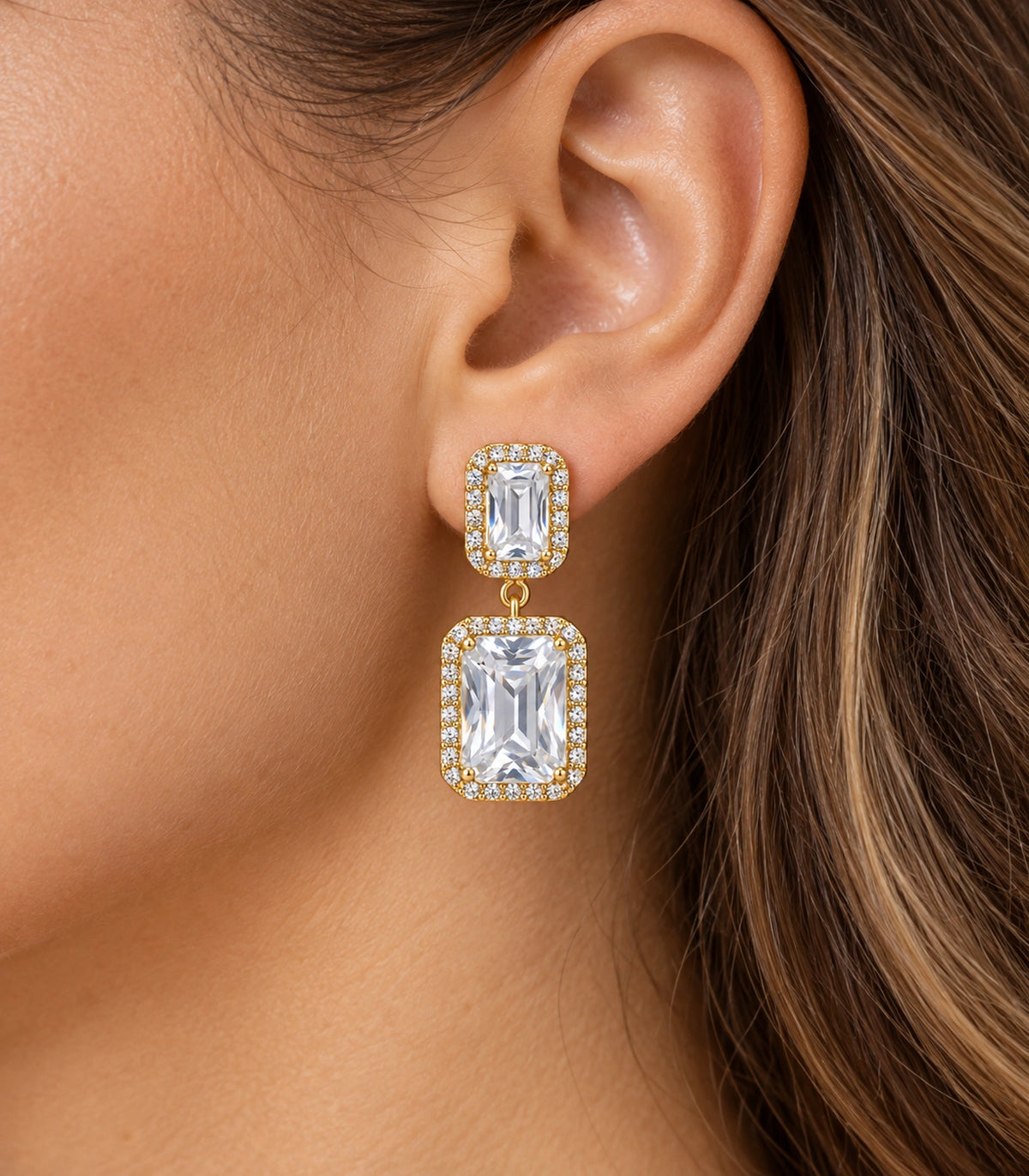 JIMIKI Gold-Tone Emerald-Cut Crystal Double Rectangle Drop Stud Earrings in Gold / Clear, close-up detail