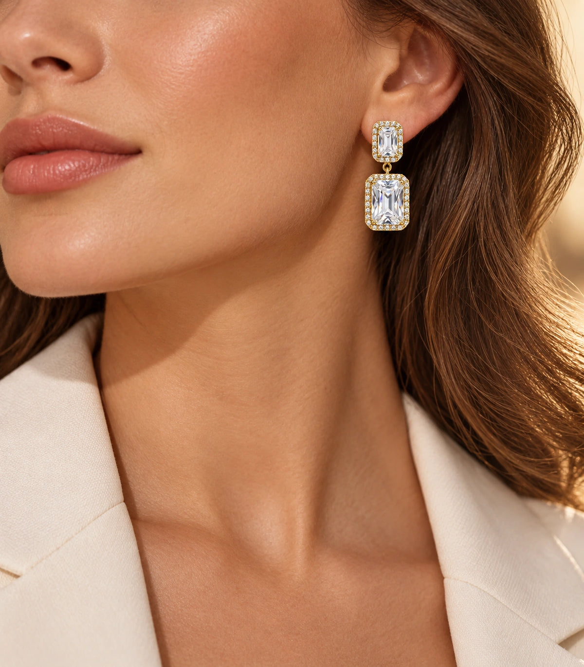 JIMIKI Gold-Tone Emerald-Cut Crystal Double Rectangle Drop Stud Earrings in Gold / Clear, editorial model view