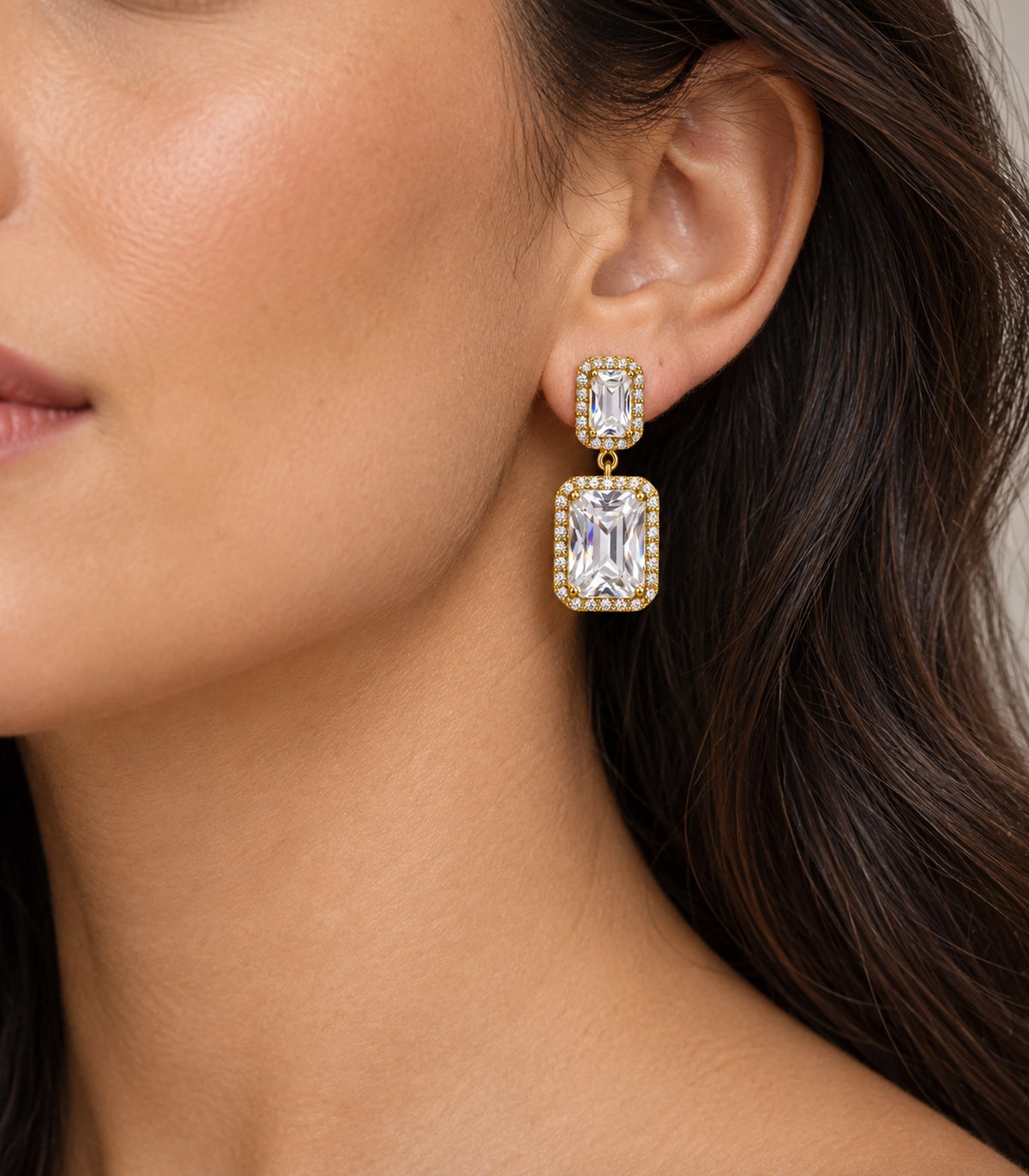 JIMIKI Gold-Tone Emerald-Cut Crystal Double Rectangle Drop Stud Earrings in Gold / Clear, model wearing view