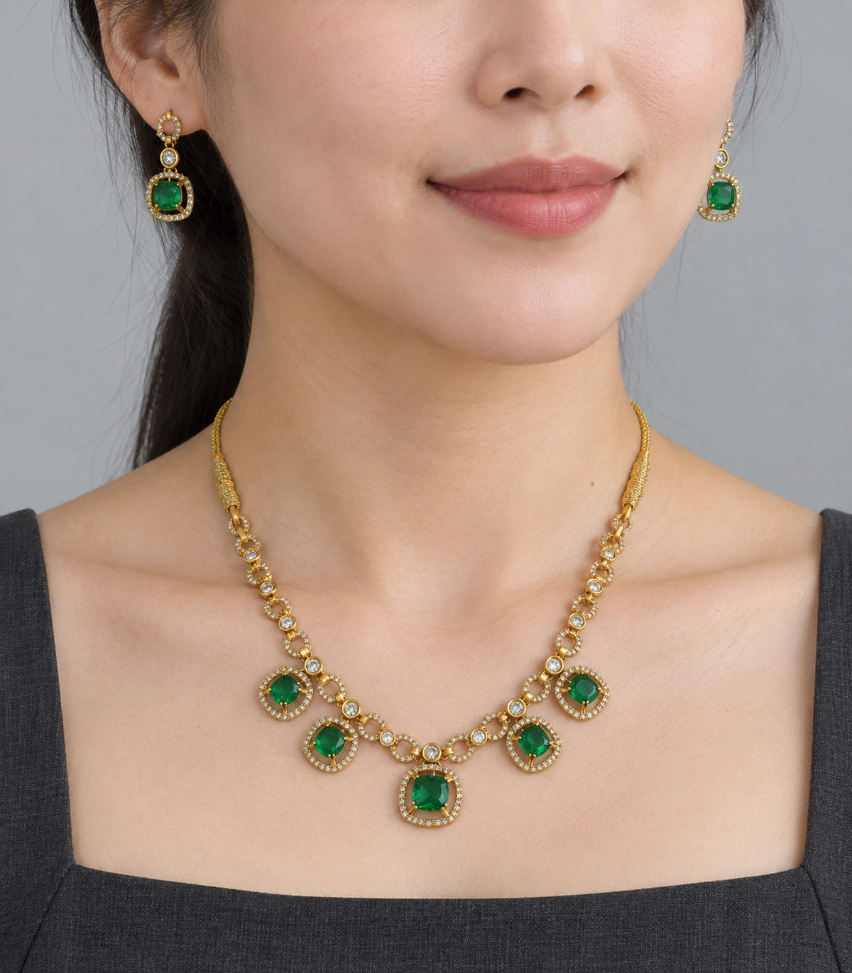 Round Crystal Teardrop Necklace Set in Emerald with gold-tone finish, worn model view #Color_Emerald
