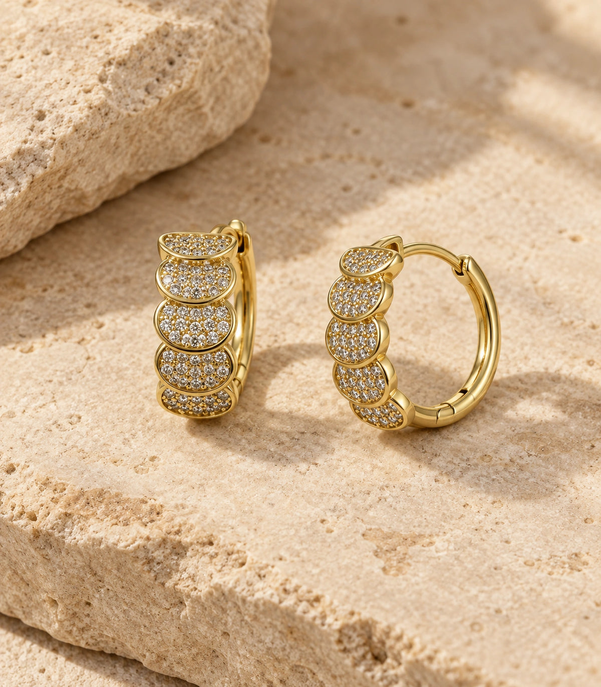 JIMIKI Five Scallop Pave Hinged Hoop Earring Pair in Gold Tone, editorial flat lay #color_gold tone