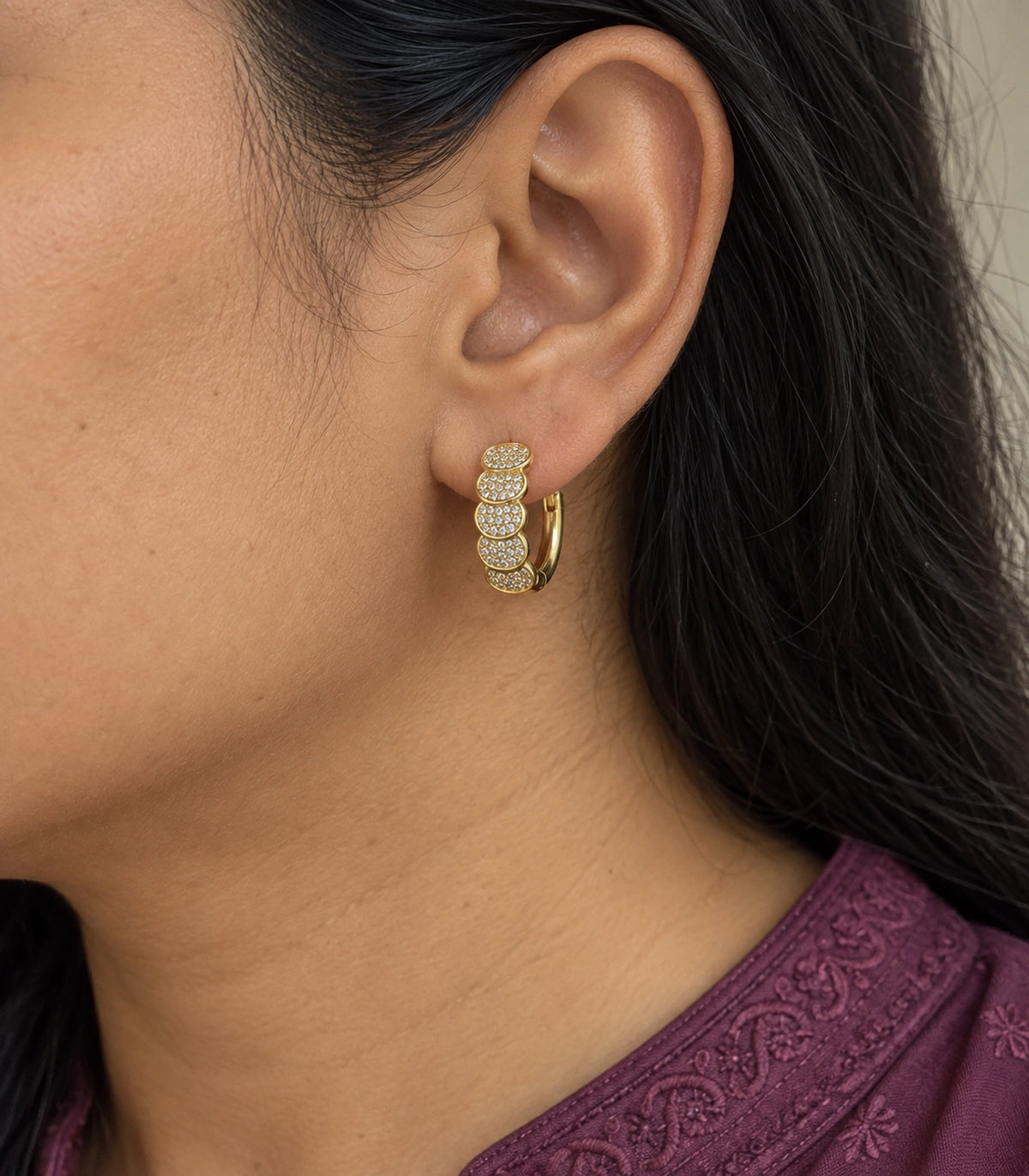 JIMIKI Five Scallop Pave Hinged Hoop Earring Pair in Gold Tone, model wearing view #color_gold tone