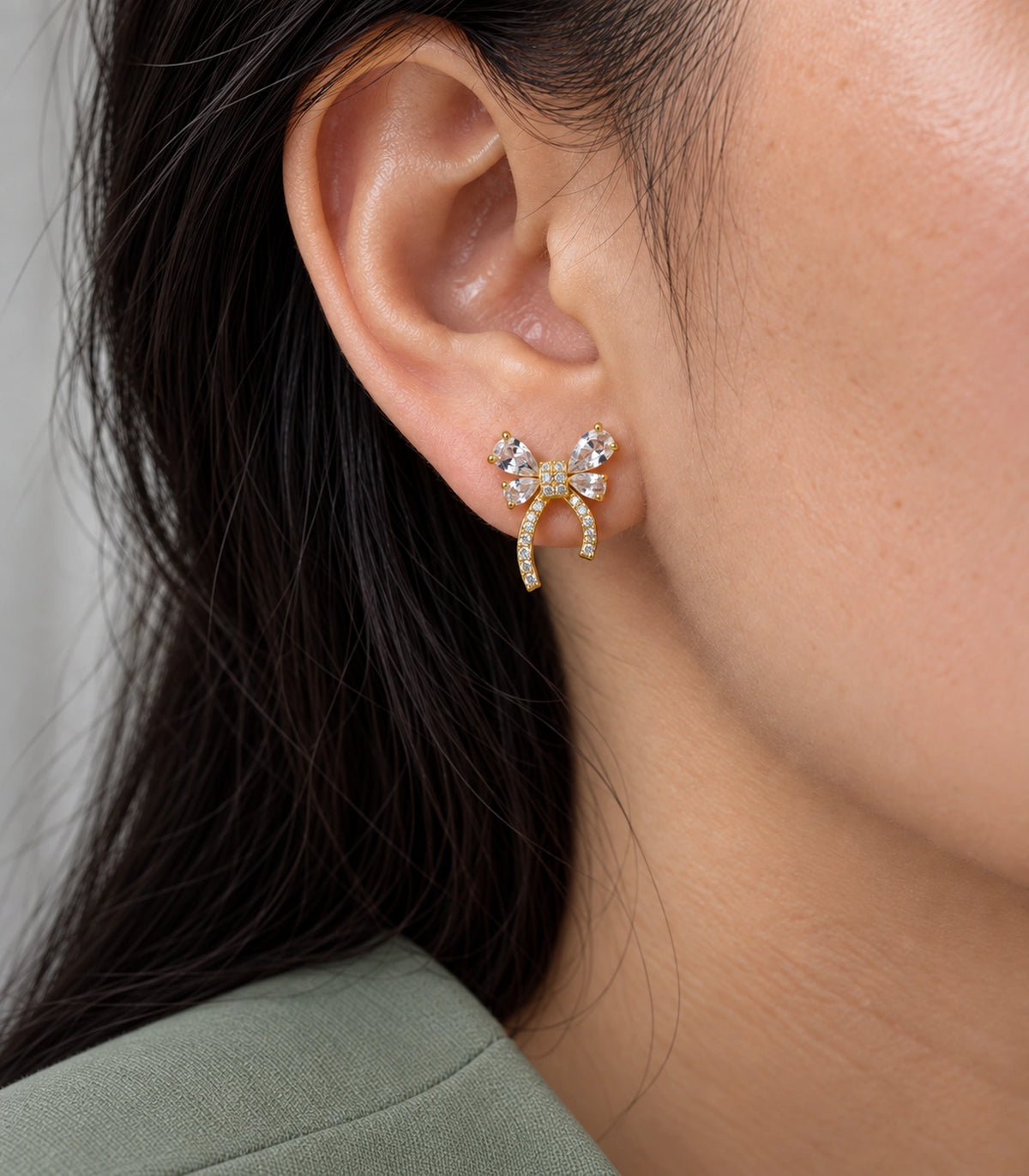 JIMIKI Four Pear Crystal Bow Stud Earring Pair in Gold Tone, close-up detail #color_gold tone