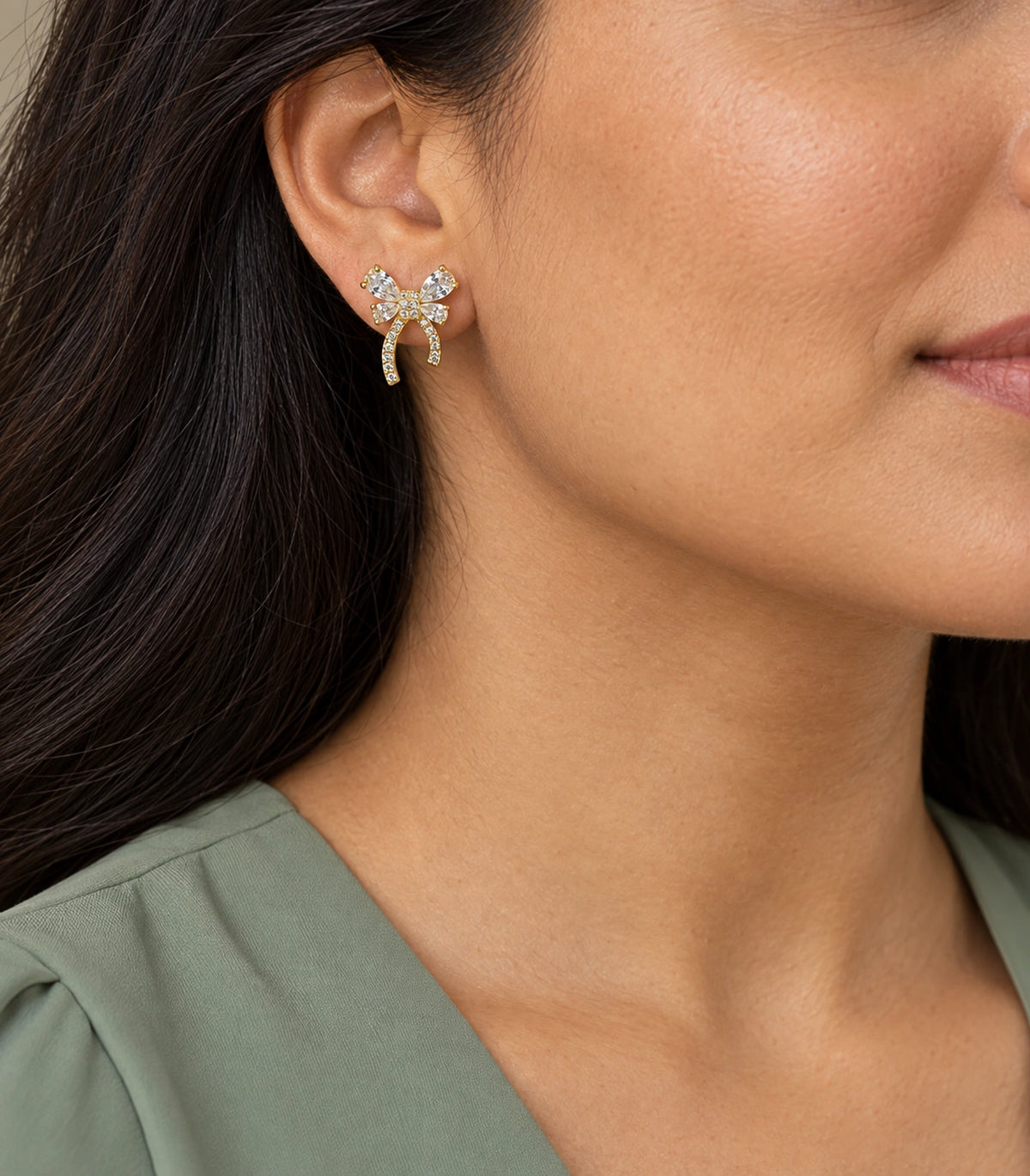 JIMIKI Four Pear Crystal Bow Stud Earring Pair in Gold Tone, model wearing view #color_gold tone