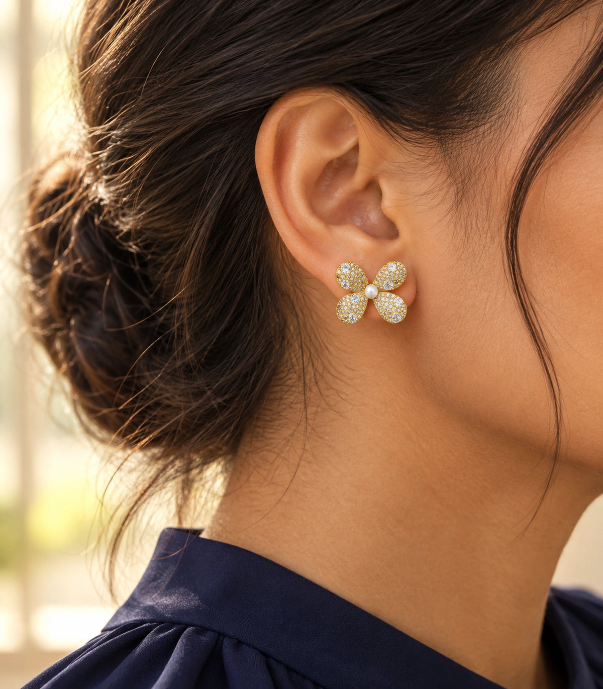 JIMIKI Four Petal Pave Pearl Centre Stud Earring Pair in Gold tone, editorial model view #color_gold tone
