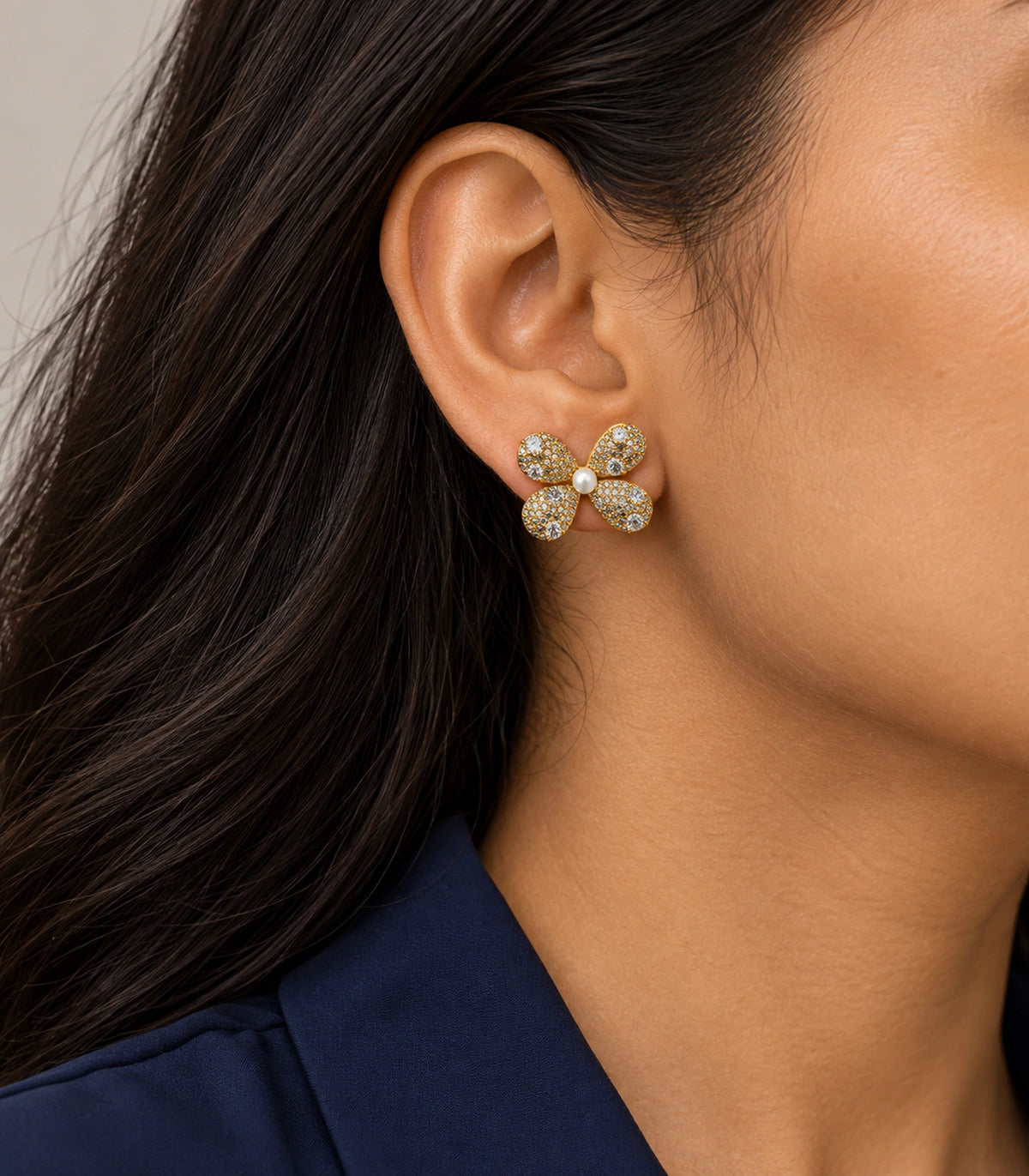 JIMIKI Four Petal Pave Pearl Centre Stud Earring Pair in Gold tone, model wearing view #color_gold tone