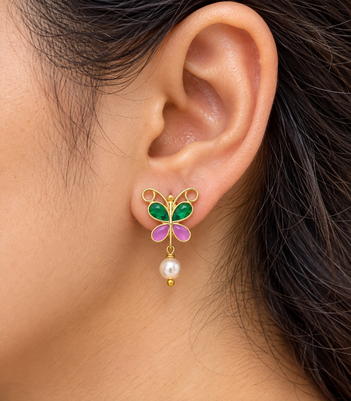 JIMIKI Green & Pink butterfly pearl drop earrings, worn detail of the design #color_green-pink