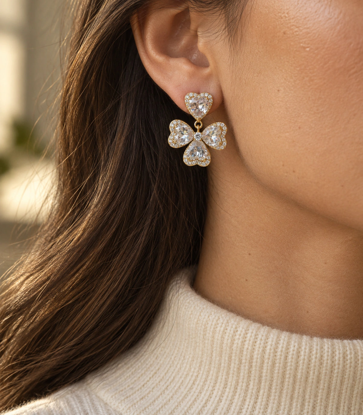 JIMIKI Heart Crystal Three Petal Drop Earring Pair in Gold-tone, editorial model view #color_gold-tone