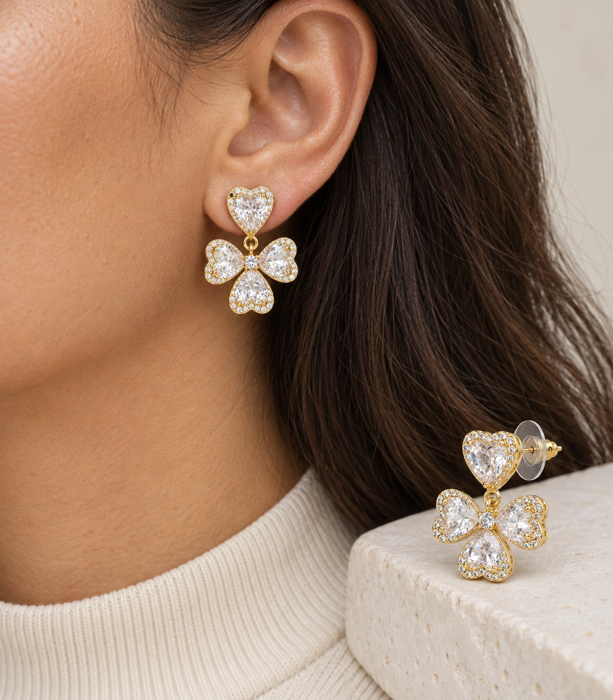JIMIKI Heart Crystal Three Petal Drop Earring Pair in Gold-tone, model wearing view #color_gold-tone