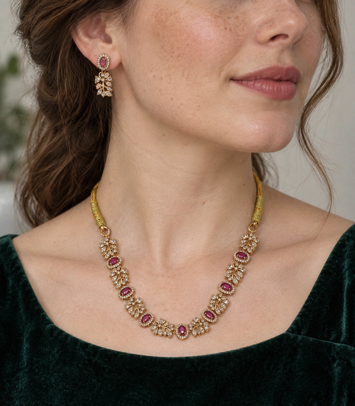 Magenta Crystal Floral-Link Necklace Set worn with a dark green outfit #Color_Magenta