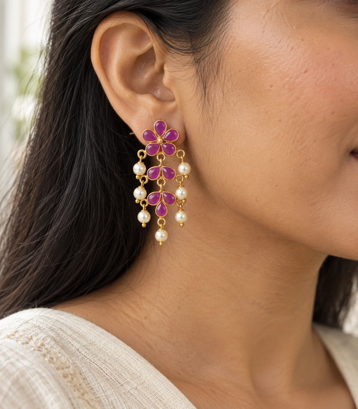 JIMIKI magenta floral pearl-style chandelier earrings, worn styling view #color_magenta