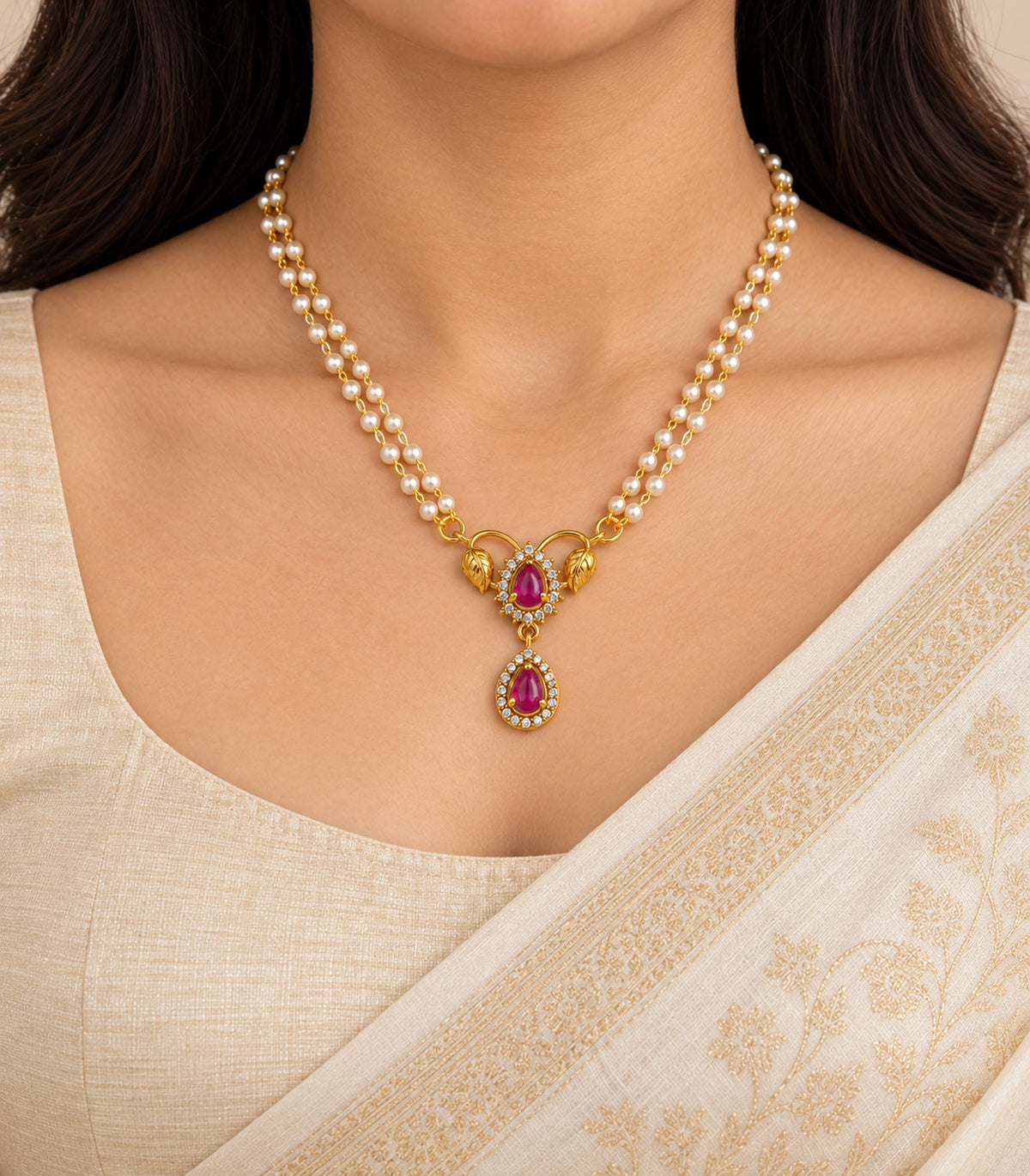 Single magenta leaf pendant necklace with twin white bead strands worn with modest cream clothing; ears and eyes outside frame.