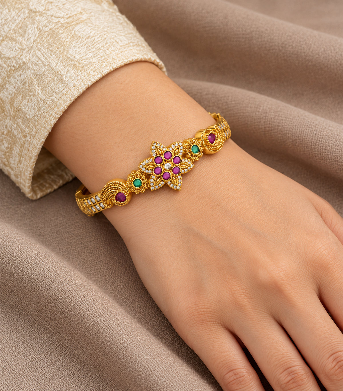 Gold-tone magenta six-stone floral bangle — closeup view; single bangle